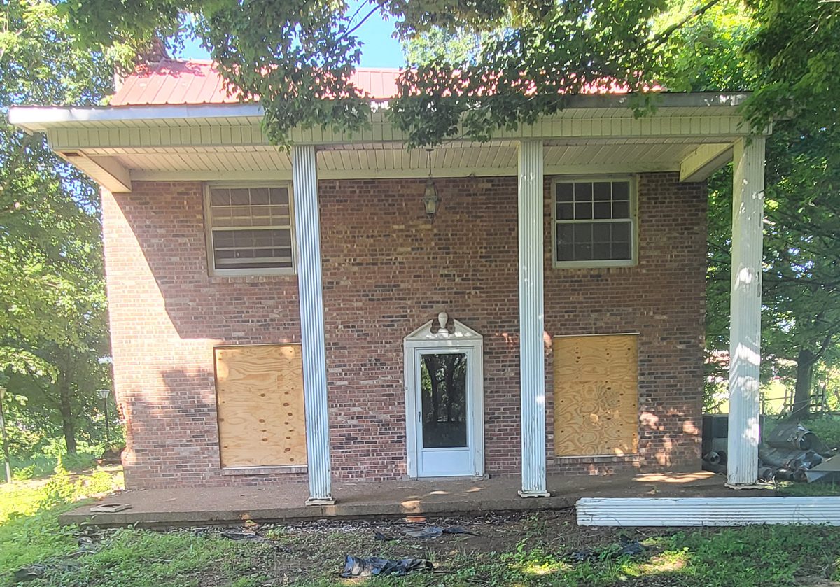 The Latimer House under its brick veneer.